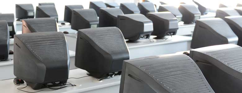 rows of computers on desks